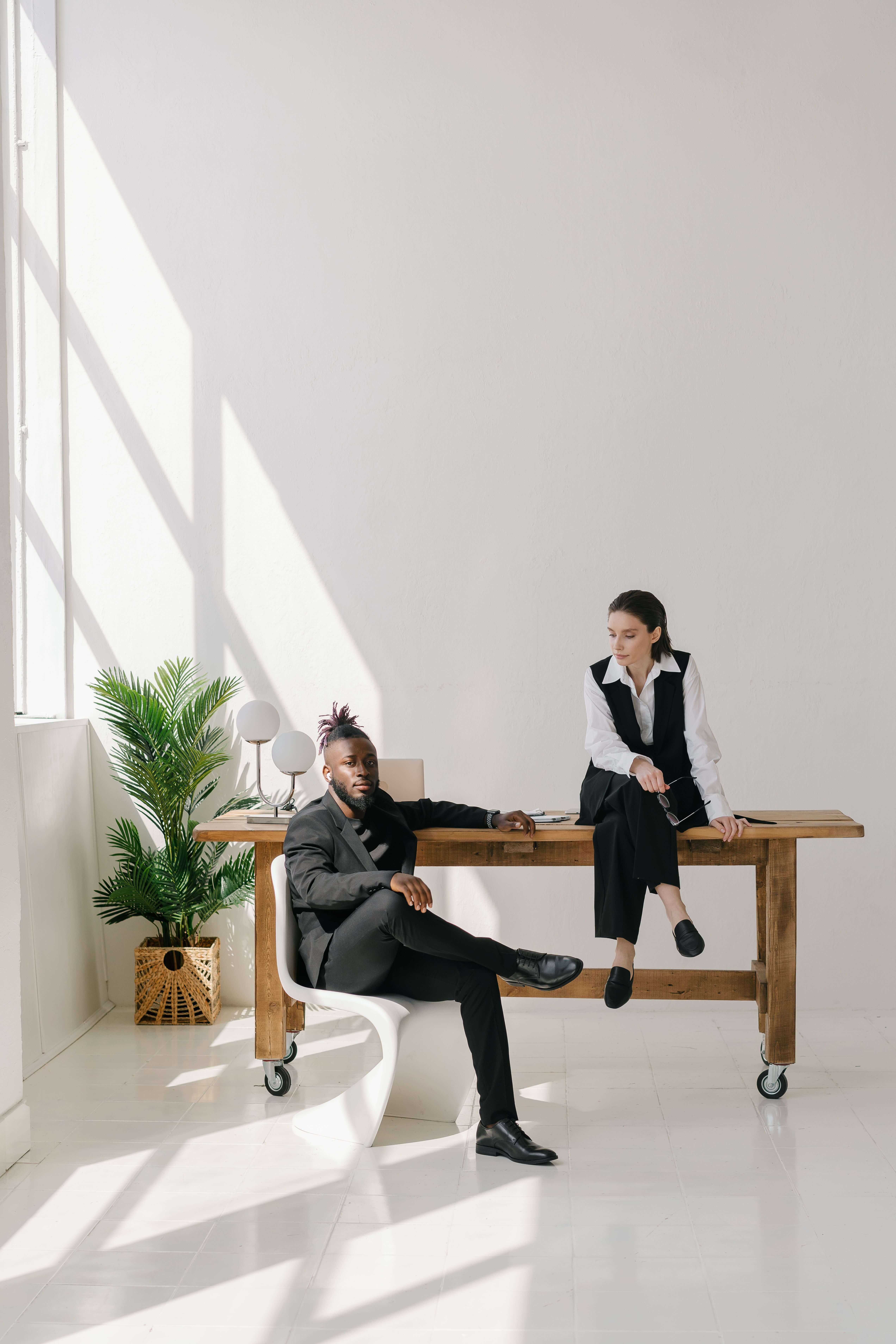 Young creatives reviewing work together at a studio table